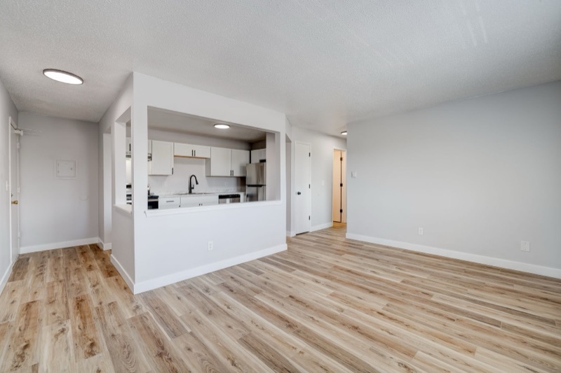 Open-concept living room and kitchen pass-through at The Hampton Meadows
